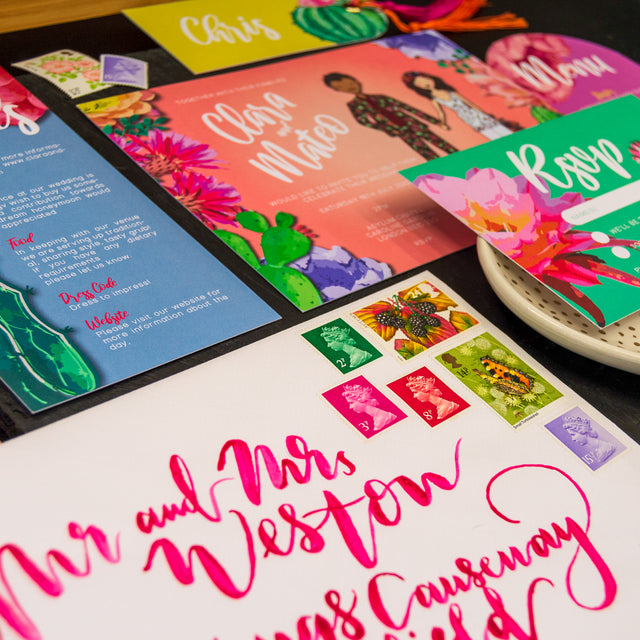 Colourful wedding invitation suite with hand lettered envelope and vintage stamps